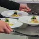 A server carries Delhaye’s final dish to the judges’ table.